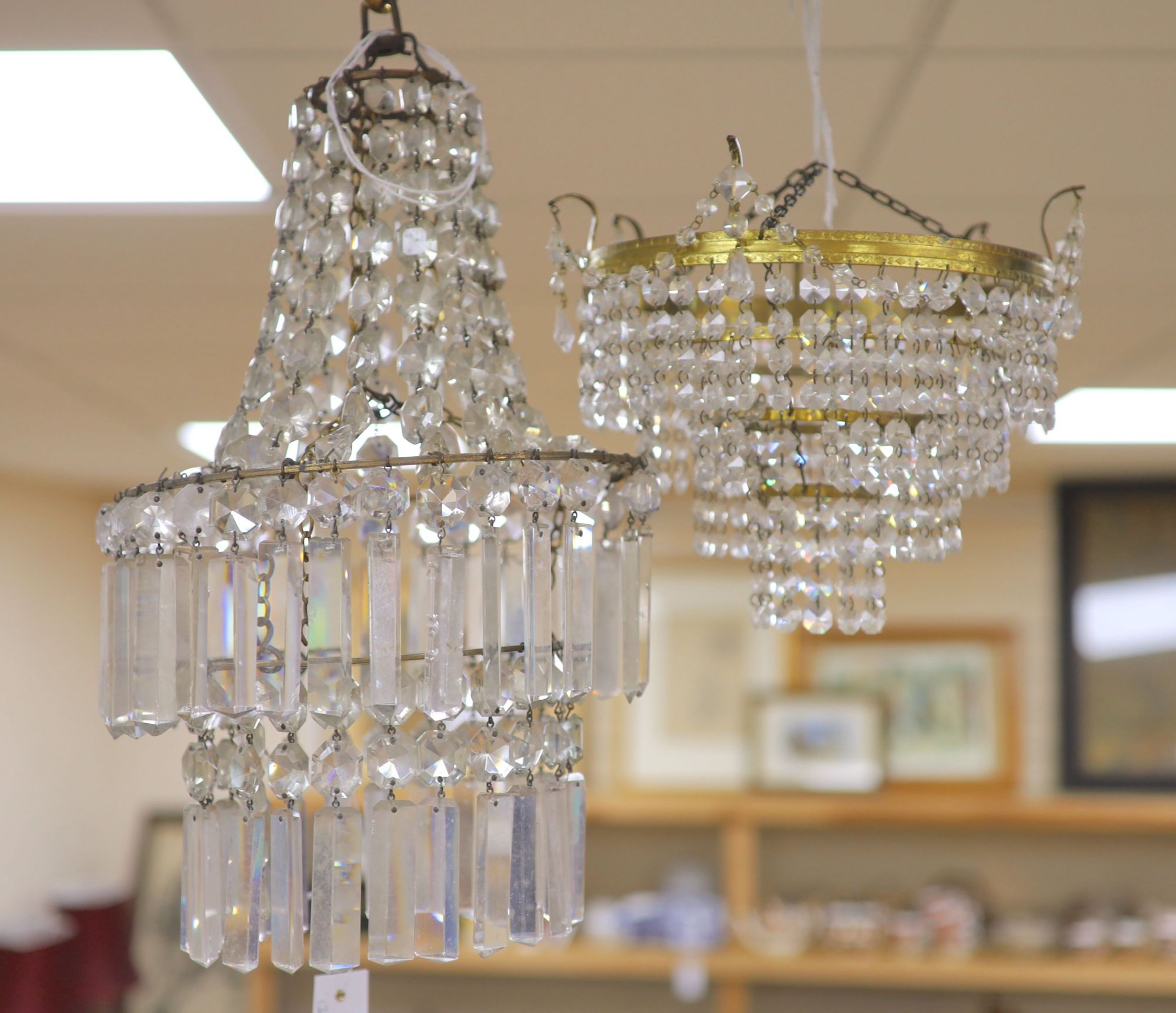 A glass lustre chandelier and another